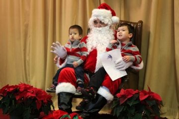 Brothers Maxwell and Christopher brought Santa a special drawing they made for him (Natavan Werbock/for NewsWorks)