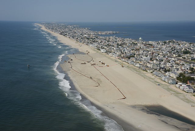  The U.S. Army Corps of Engineers Philadelphia District pumps sand onto Brant Beach, NJ in June 2013. The work is part of an effort to restore the Coastal Storm Risk Management project from damages associated with Hurricane Sandy. (Image: U.S. Army Corps of Engineers)  