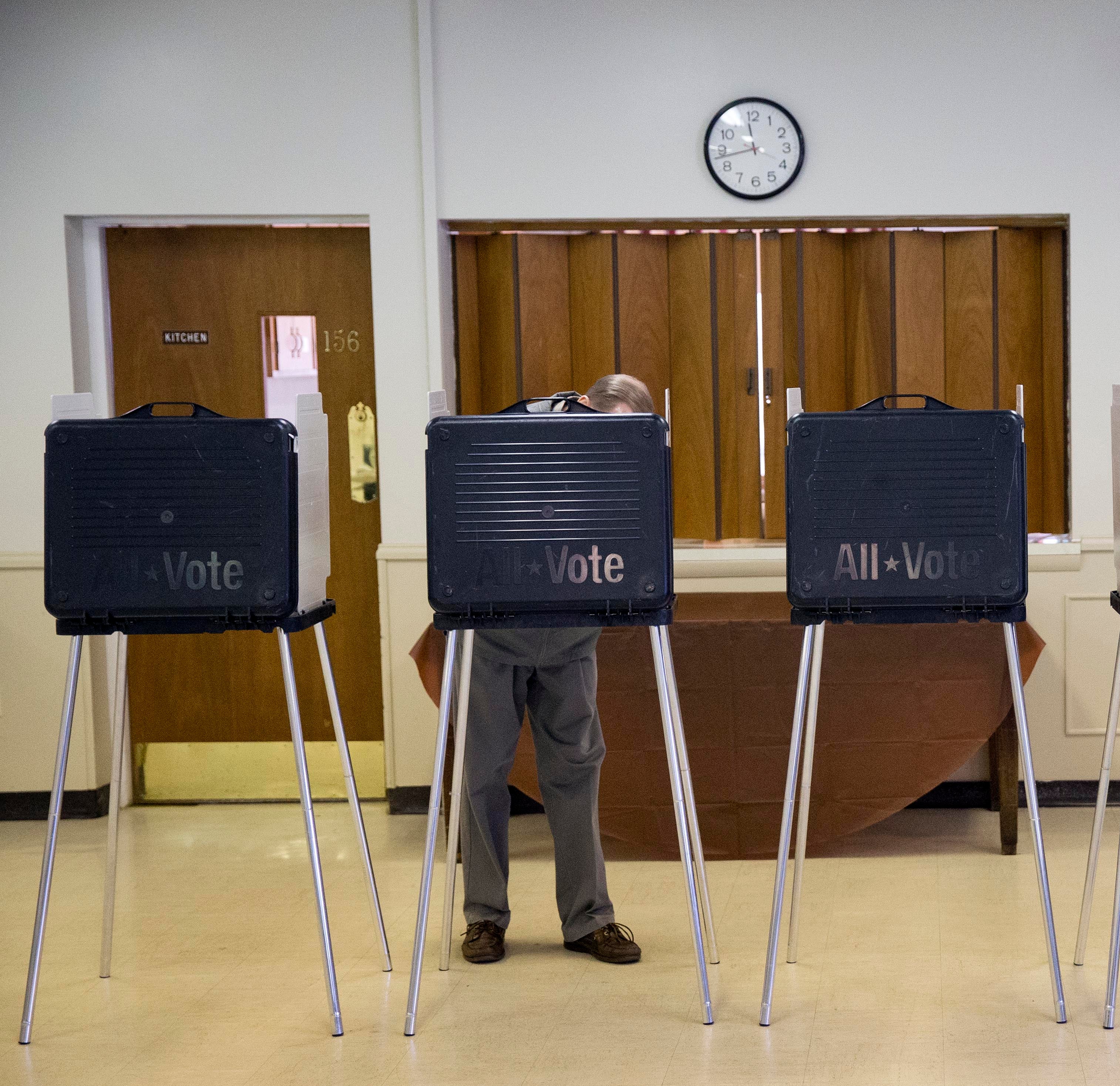 A voter fills out his ballot on election day (Matt Rourke/AP Photo)