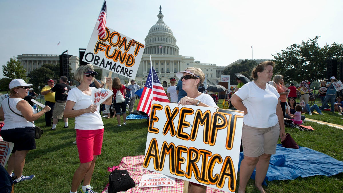  Protesters hold banners during an 