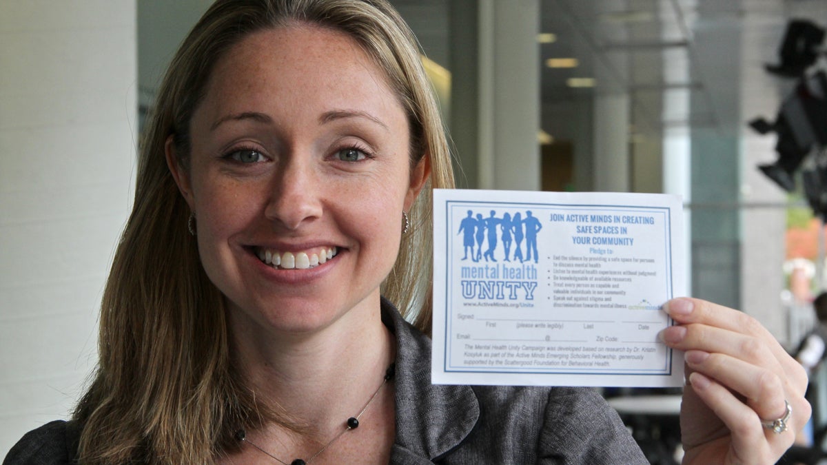  Alison Malmon founder of Active Minds displays one of the pledge forms. (Emma Lee/WHYY) 