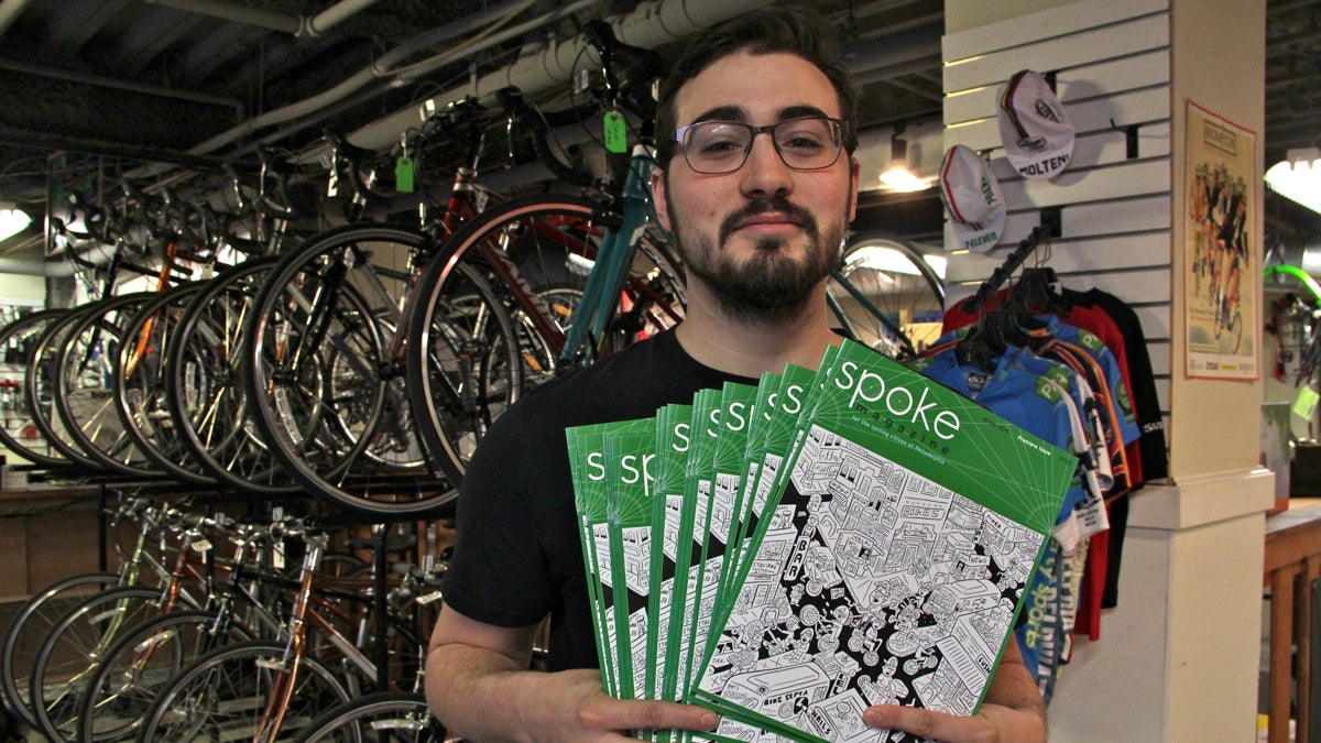  Alex Vuocolo, editor of the new urban cycling magazine Spoke, drops off some copies at Trophy Bikes on Second Street. (Emma Lee/WHYY) 