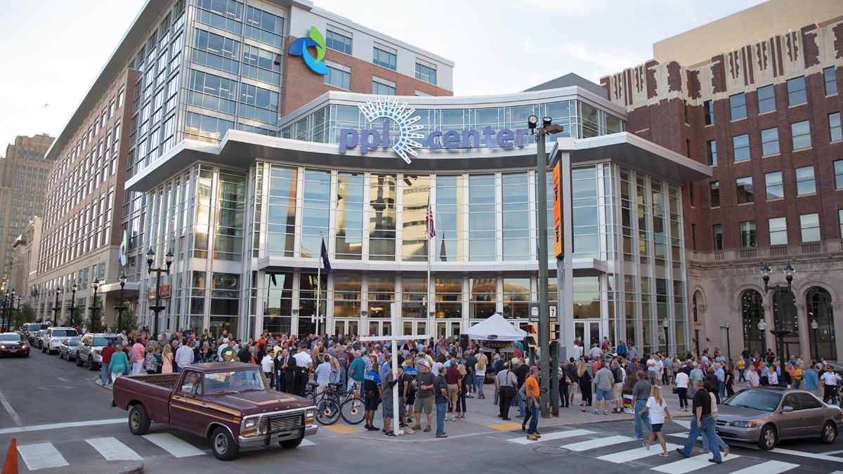  Crowds gather outside of the PPL Center in downtown Allentown on opening night — a sold out Eagles concert. The new arena will be home to the Lehigh Valley Phantoms hockey team and is the heart of the city's Neighborhood Improvement Zone. (Lindsay Lazarski/WHYY) 