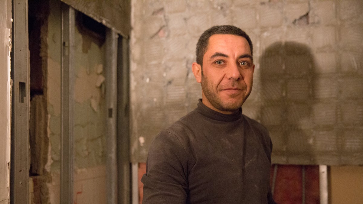  Japour Ibrahim, a Syrian refugee, said he came to Allentown with his family in April 2015. There he found work helping to restore the Americus Hotel in Center City, Allentown. (Lindsay Lazarski/WHYY) 