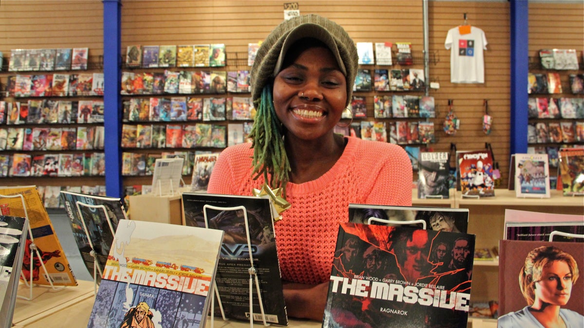 Ariell Johnson's new venture, Amalgam Comics and Coffeehouse in Kensington, has her busy keeping the books, stocking the shelves and baking cookies. (Emma Lee/WHYY)