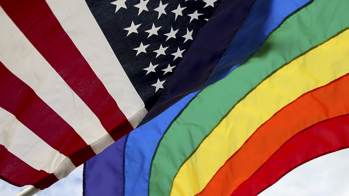  An American flag and a gay pride flag flies in front of the Supreme Court in Washington. (AP Photo/Andrew Harnik, file) 