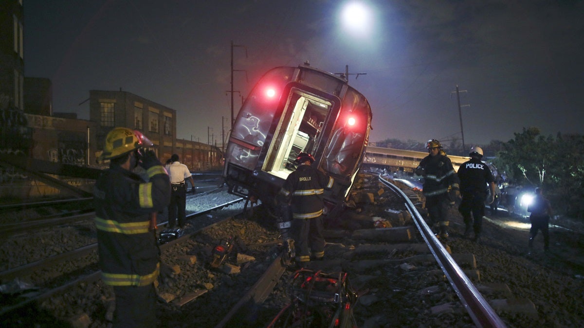  Emergency personnel work the scene of a deadly train wreck in Philadelphia. Delaware Senator Tom Carper had been on the train earlier in the evening. (AP Photo/ Joseph Kaczmarek) 