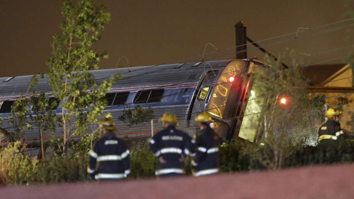  Emergency personnel work the scene of a train wreck, Tuesday, May 12, 2015, in Philadelphia. An Amtrak train headed to New York City derailed and crashed in Philadelphia. (Matt Slocum/AP Photo) 