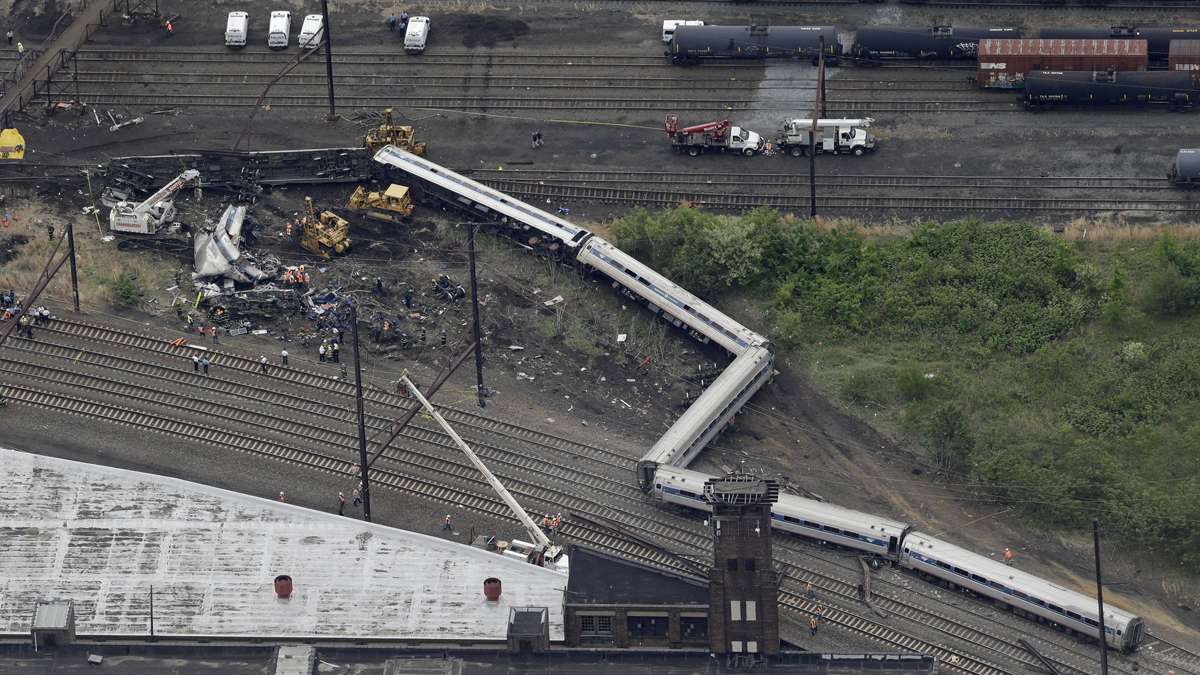 Emergency personnel work at the scene of a deadly train derailment, Wednesday, May 13, 2015, in Philadelphia. The Amtrak train, headed to New York City, derailed and crashed in Philadelphia on Tuesday night, killing at least six people and injuring dozens of others. (Patrick Semansky/AP Photo) 