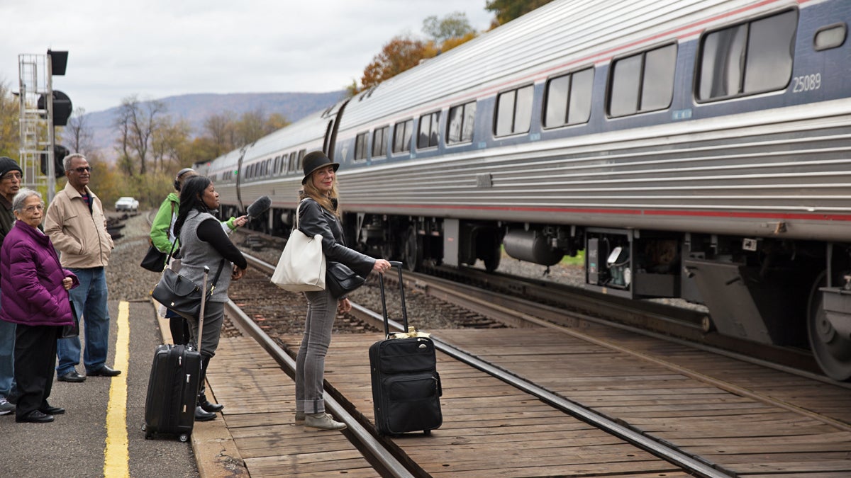 Joanne Landis (with black hat) gets ready to board an Amtrak train enroute to New York City at the Lewistown Station in Pennsylvania.  There is only one round-trip passenger train that runs from Harrisburg to Pittsburgh