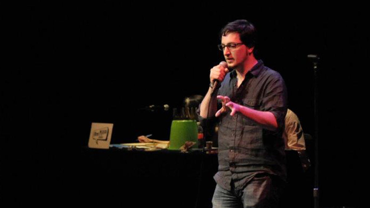  Andrew Panebianco is shown telling a story at a First Person Arts story slam. (Image courtesy of First Person Arts) 
