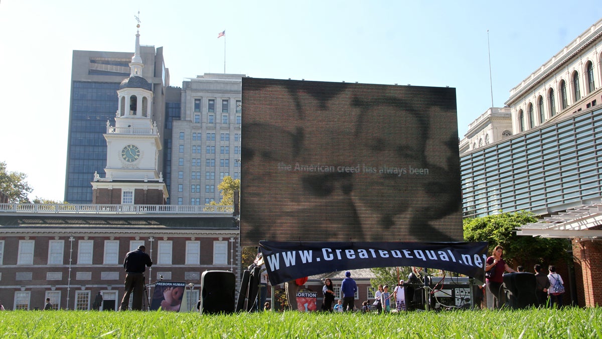 Anti-abortion activists set up a graphic display on Independence Mall. (Emma Lee/WHYY)