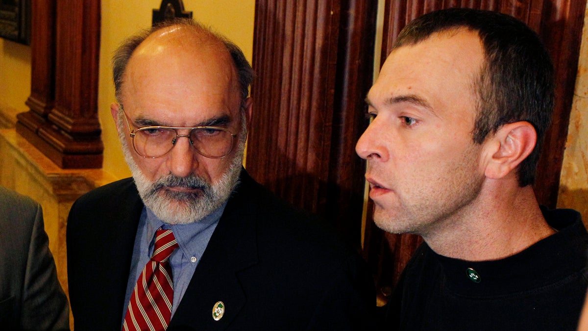  Ken Wolski of the Coalition for Medical Marijuana New Jersey listens as Charles Kwiatkowski, right, of Hazlet, N.J., who suffers from multiple sclerosis, describes his need for medical marijuana in 2010. (Mel Evans/AP Photo) 