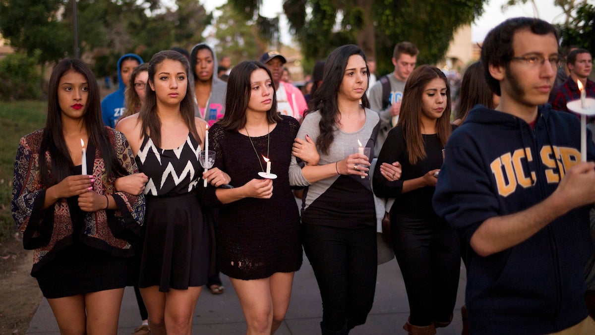  In this May 24, 2014 file photo, students march on the campus of the University of California, Santa Barbara during a candlelight vigil held to honor the six victims of a mass killing in Isla Vista, Calif. Sheriff's officials said Elliot Rodger, 22, went on the rampage near UC Santa Barbara. Accounts of Rodger's hostility to women, and his bitterness over sexual rejection, led to an outpouring of commentary and online debate over the extent of misogyny and male entitlement. (AP Photo/Jae C. Hong, File) 