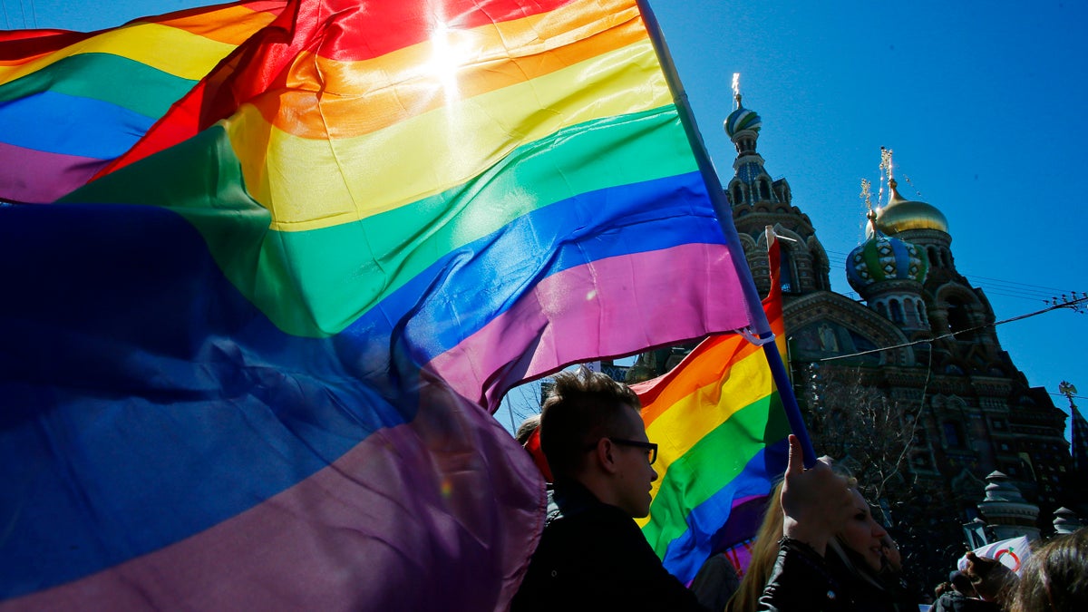  Gay rights activists carry rainbow flags as they march during a May Day rally in St. Petersburg, Russia. (AP Photo/Dmitry Lovetsky, file). 