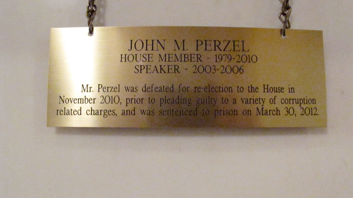  The plaque hanging in the Pennsylvania Capitol below the official portrait of former House Speaker John Perzel and three other former top state lawmakers in Harrisburg, Pa., now includes information about their criminal histories. (Marc Levy/AP Photo) 