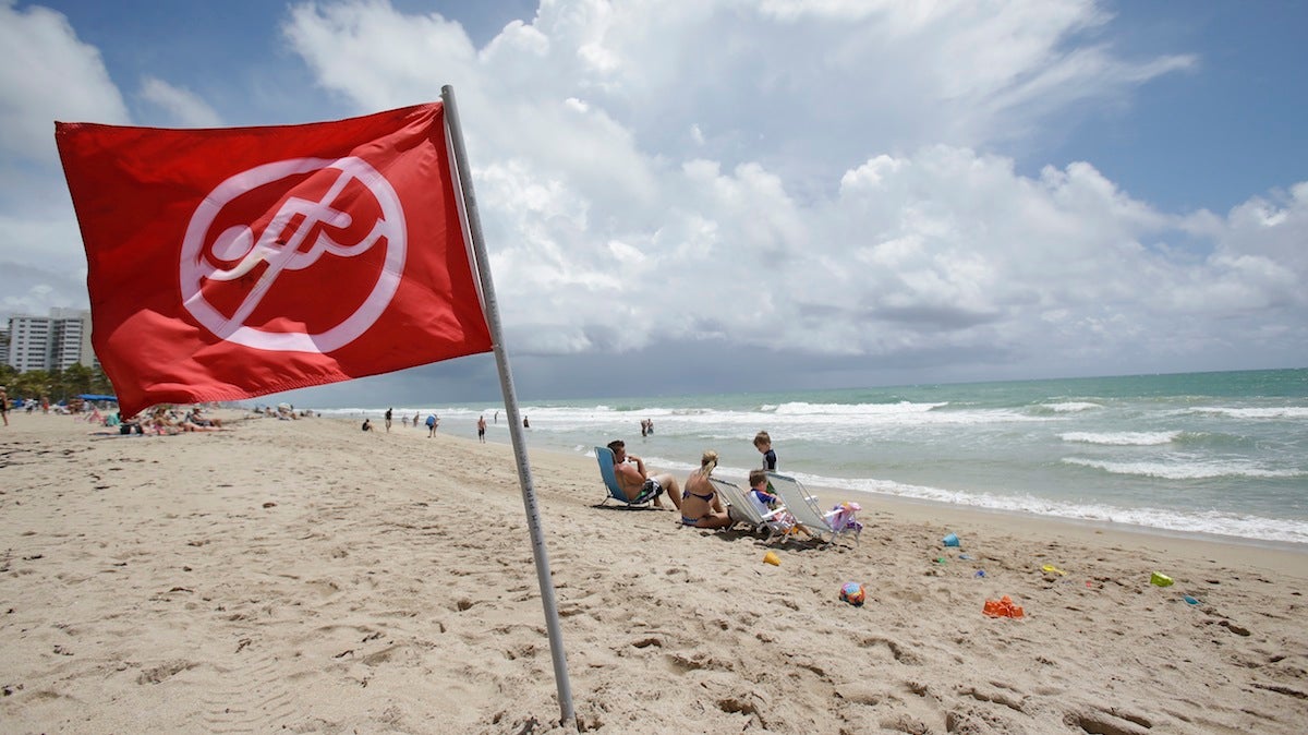  A no swimming flag flies on the beach in an area where there is a known rip current, Tuesday, May 13, 2014 in Fort Lauderdale, Fla. (AP Photo) 