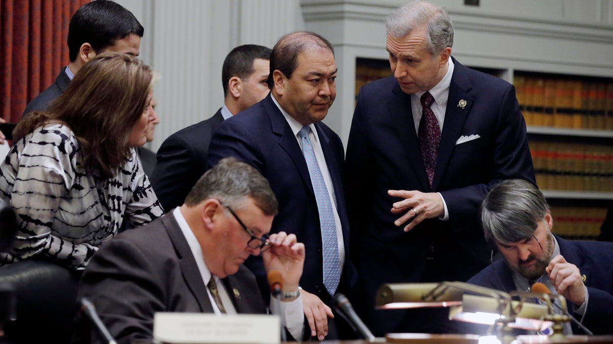  New Jersey Sen. Kevin O'Toole, center, listens to Sen. John Wisniewski, standing right, as the legislative committee prepares to hear testimony on Bridgegate. (AP file photo/Mel Evans) 