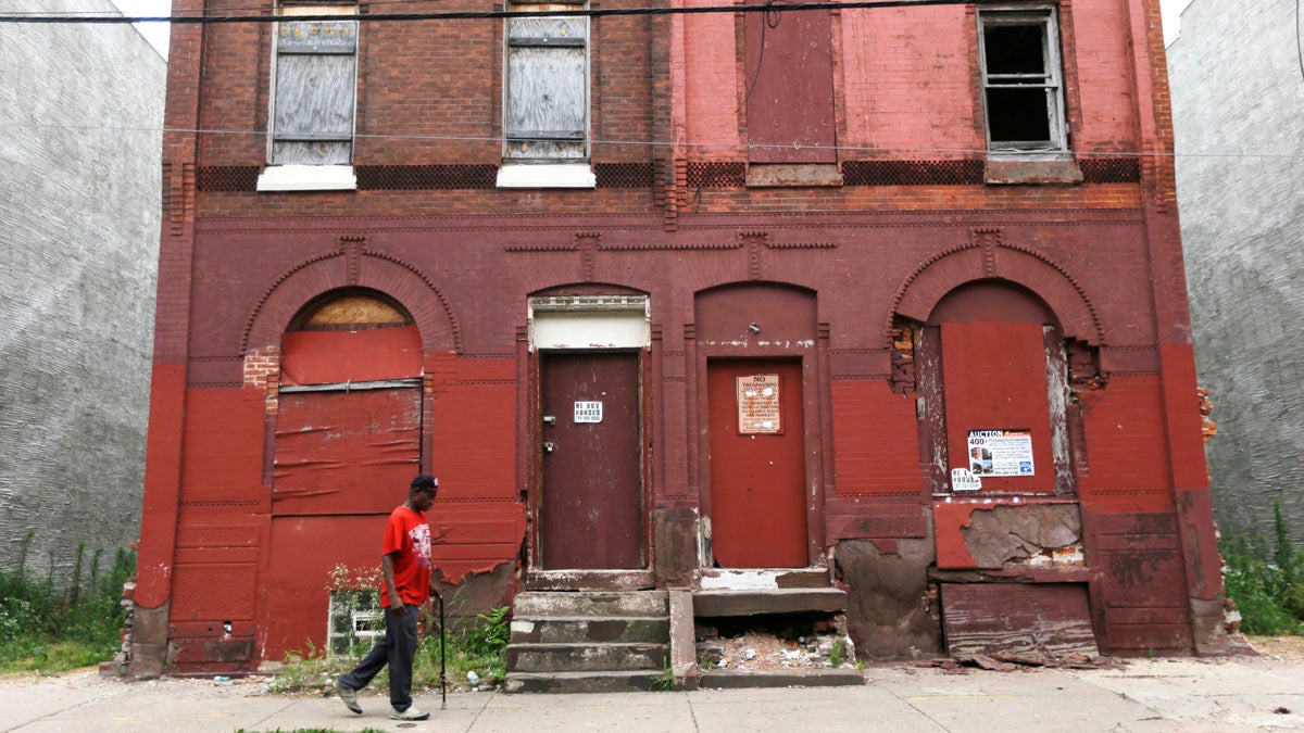 
A man walks through a blighted neighborhood in Philadelphia. (Matt Rourke/AP Photo) 