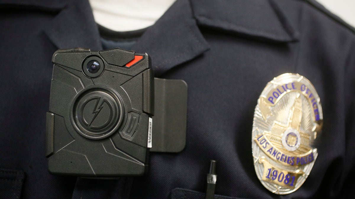  A Los Angeles police officer wears an on-body camera during a demonstration. New Jersey is looking into a statewide launch of the cameras. (AP file photo) 