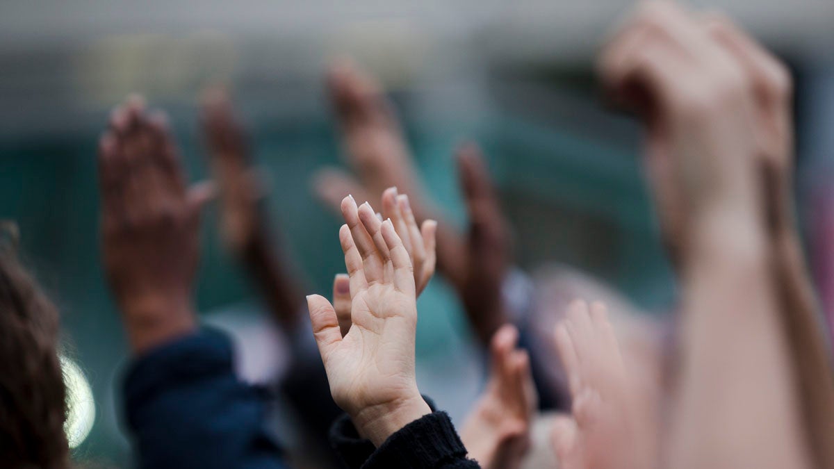  Demonstrators hold up their hands during a Wednesday protest in Philadelphia.  On Friday, protesters gathered to urge shoppers to become socially and politically active following the events in Ferguson, Missouri. (Matt Rourke/AP photo) 