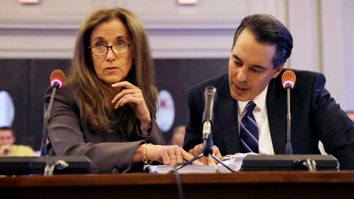  The New Jersey legislative panel investigating the George Washington  Bridge lane-closing scandal  is seeking phone records of Regina Egea, shown listening to a question along with attorney Michael Martinez in July. (AP file photo) 