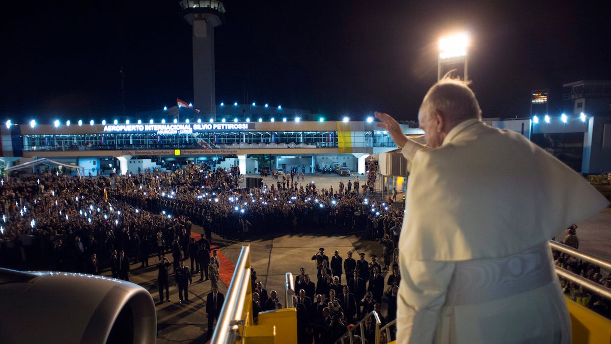  In this photo taken on Sunday, July 12, 2015, Pope Francis waves as he boards the plane back to Rome, in Asuncion, Paraguay. Pope Francis departed after a week long trip to Ecuador, Bolivia and Paraguay. (L'Osservatore Romano/Pool Photo via AP) 