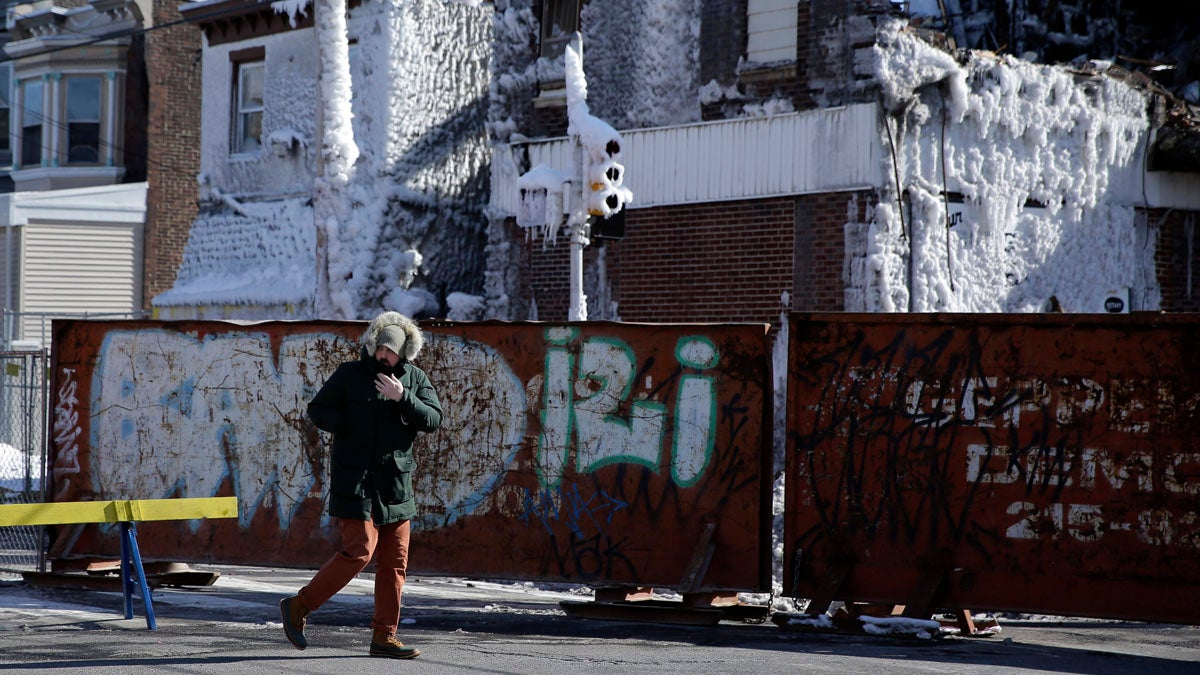  An abandoned car and a tree limb that took out a utility line block a road in the aftermath of a winter storm Thursday, Feb. 6, 2014. An ice storm left more than 849,000 Pennsylvania households and businesses without electricity last week.  (AP Photo/Matt Rourke) 