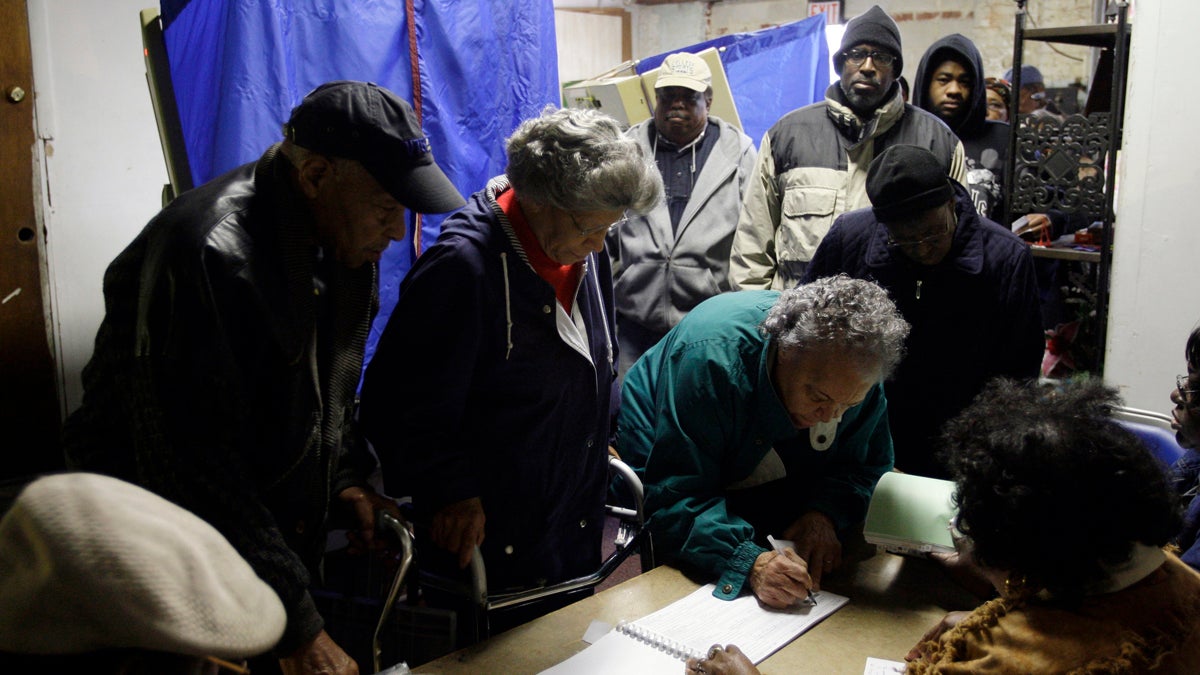 Voters sign polling book in Philadelphia. (AP file photo)