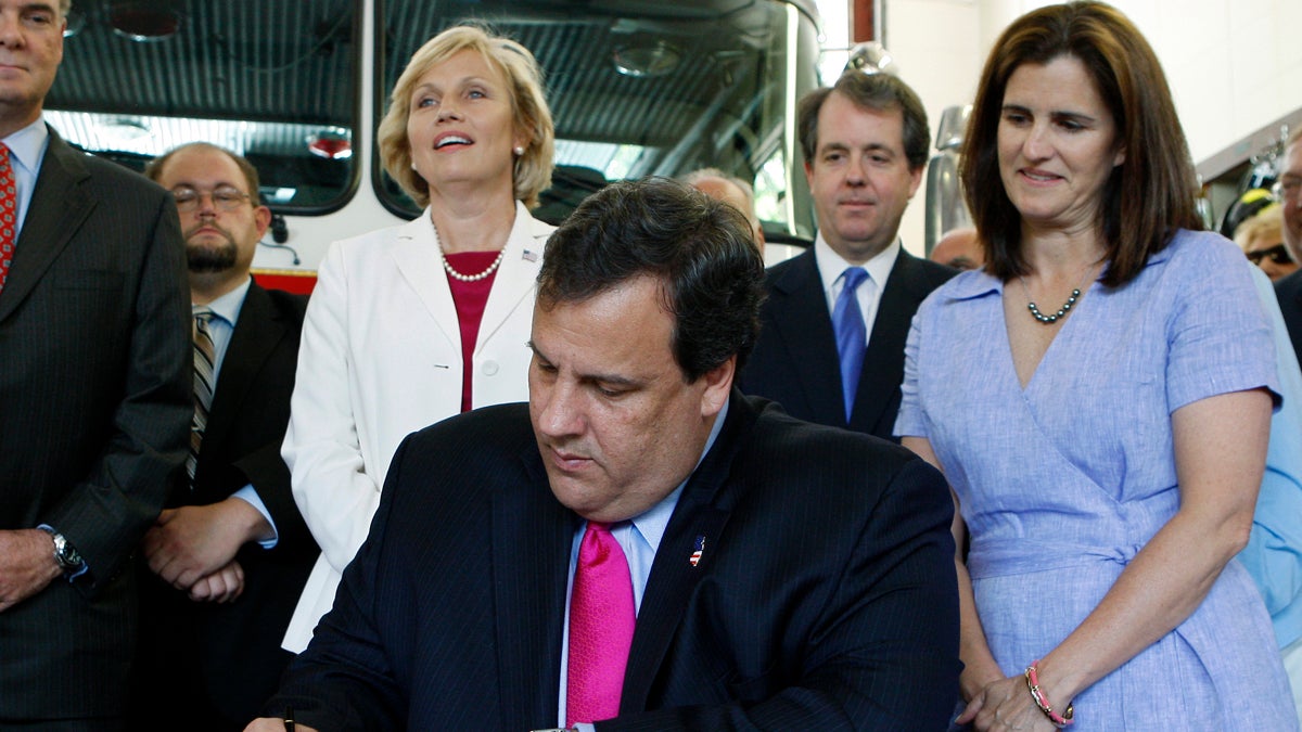 Chris Christie, Mary Pat Christie, Kim Guadagno, Andrew Eristoff New Jersey Gov. Chris Christie signs the state's budget into law Tuesday June 29, 2010. (AP Photo/Mel Evans)