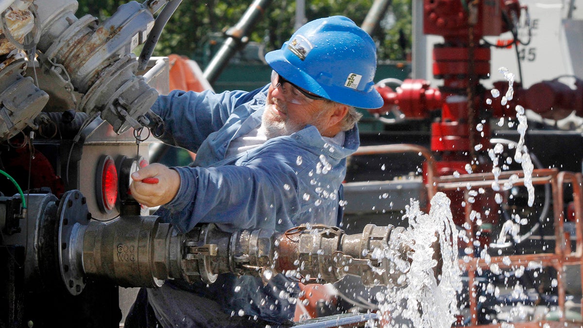 A local contractor closed a valve on his tanker truck outside Range Resources in Claysville