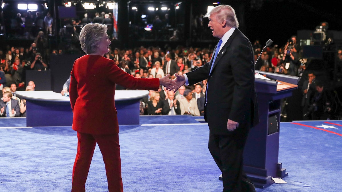 Democratic presidential nominee Hillary Clinton shakes hands with Republican presidential nominee Donald Trump after the presidential debate at Hofstra University in Hempstead