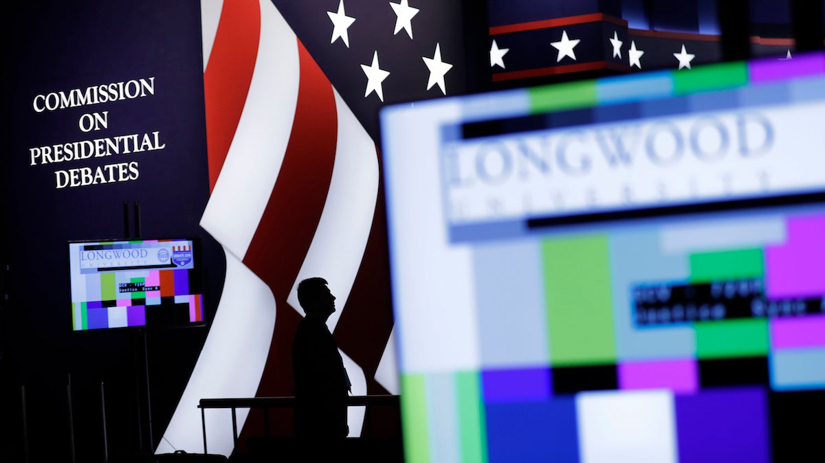 An official stands on stage during preparations for the vice-presidential debate between Republican vice-presidential nominee Gov. Mike Pence and Democratic vice-presidential nominee Sen. Tim Kaine in at Longwood University in Farmville, Va., Monday, Oct. 3, 2016.(AP Photo/AP Photo/Patrick Semansky)