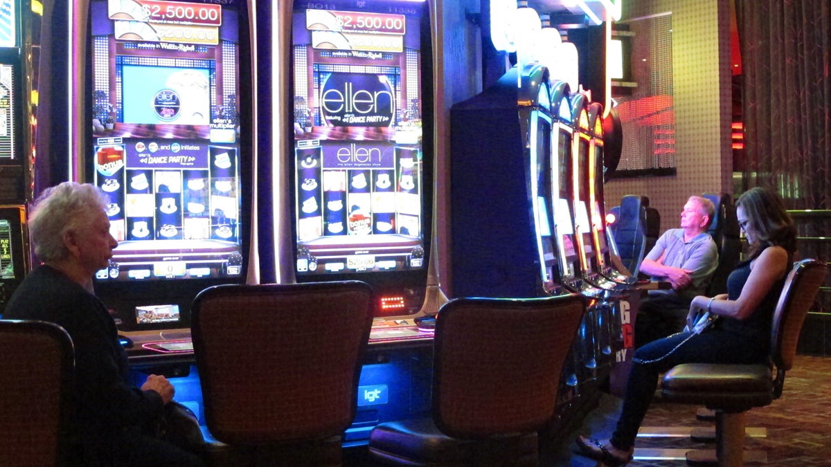Gamblers sit at slot machines at the Golden Nugget casino in Atlantic City