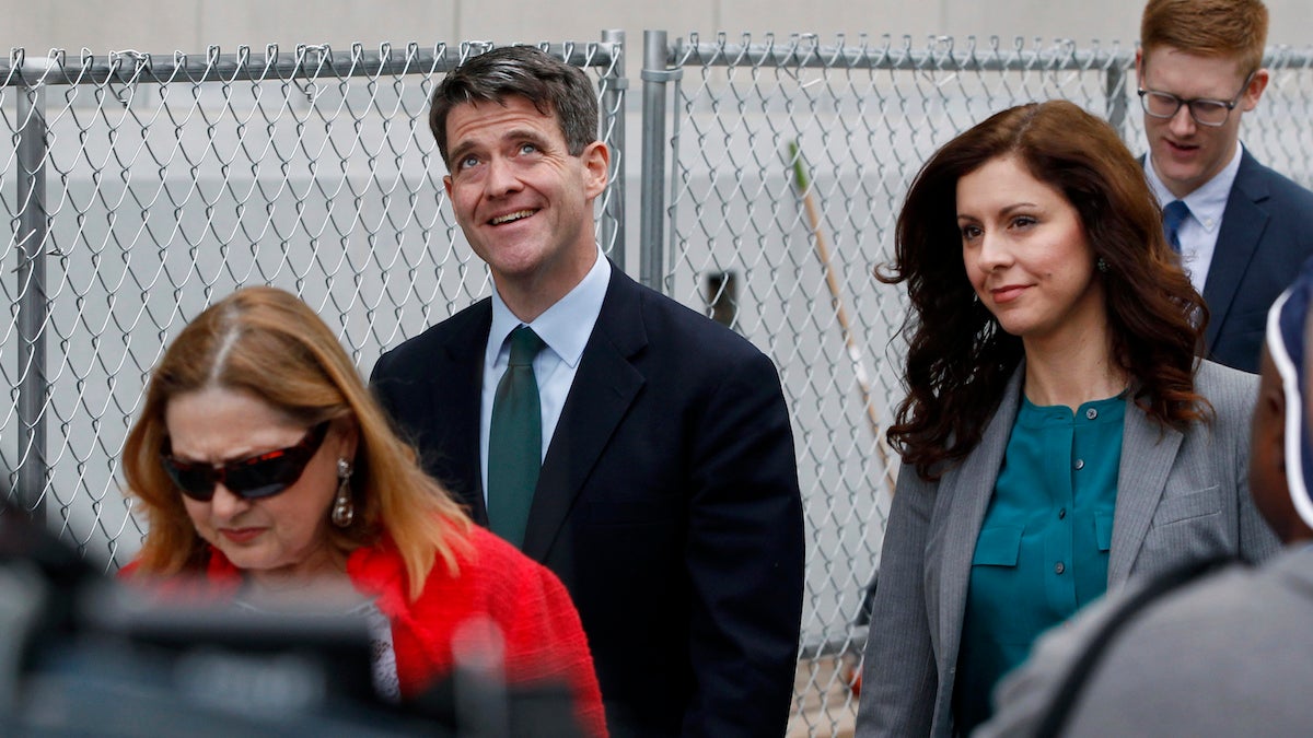 Bill Baroni (center) looks up while walking with his attorney Jennifer Mara (second right) as they leave Martin Luther King Jr. Federal Courthouse after court proceedings
