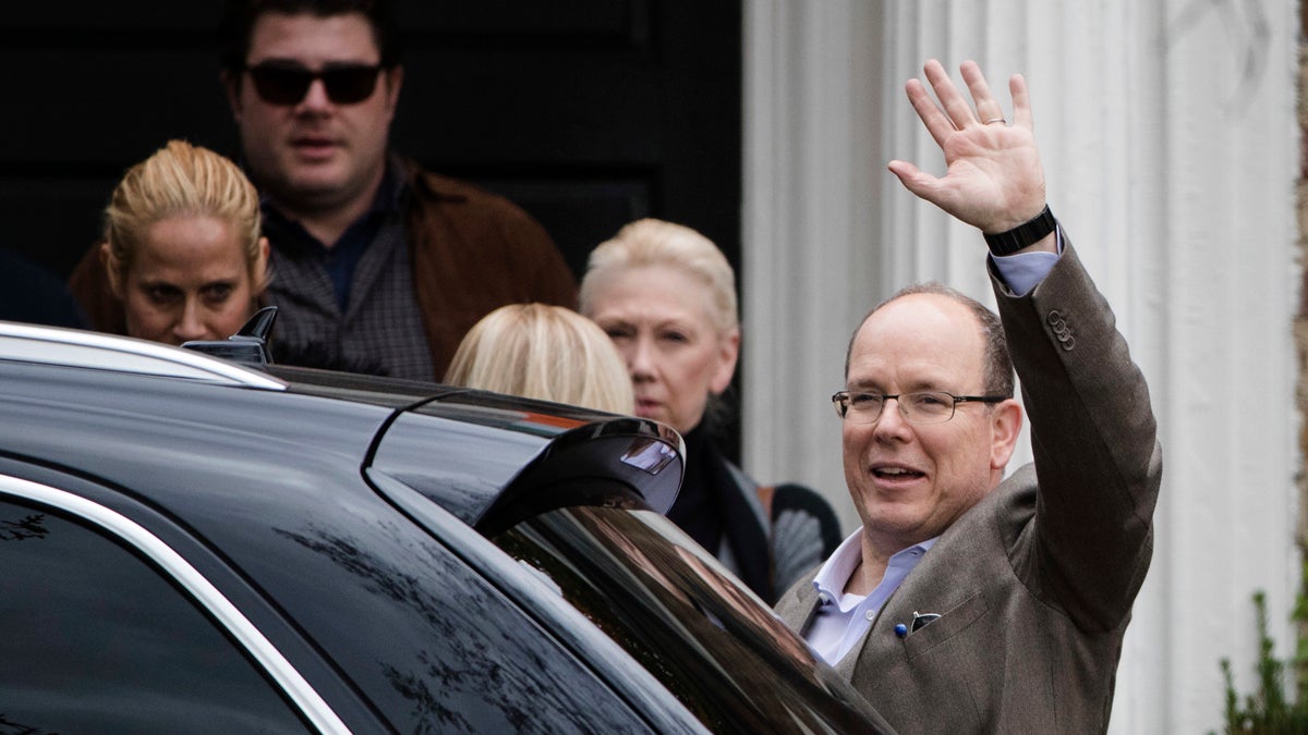 Prince Albert II of Monaco waves after touring a house he recently purchased in Philadelphia, Tuesday, Oct. 25, 2016. Its the home where his mother, Oscar-winning actress Grace Kelly, grew up and accepted a marriage proposal from Prince Rainier III of Monaco. (AP Photo/Matt Rourke)