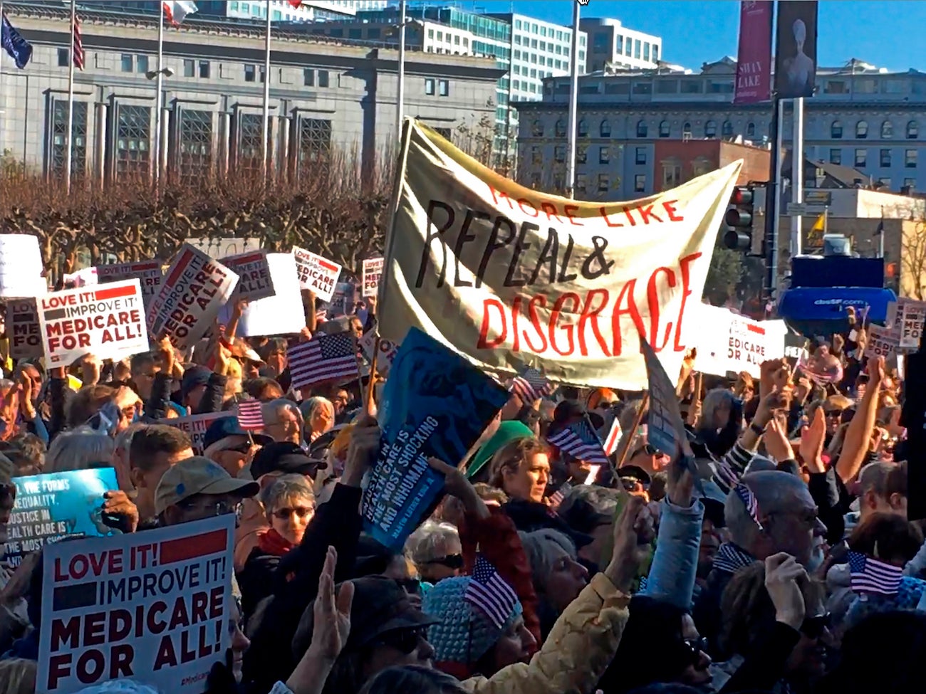 People rally against the dismantling of the Affordable Care Act during a gathering in San Francisco