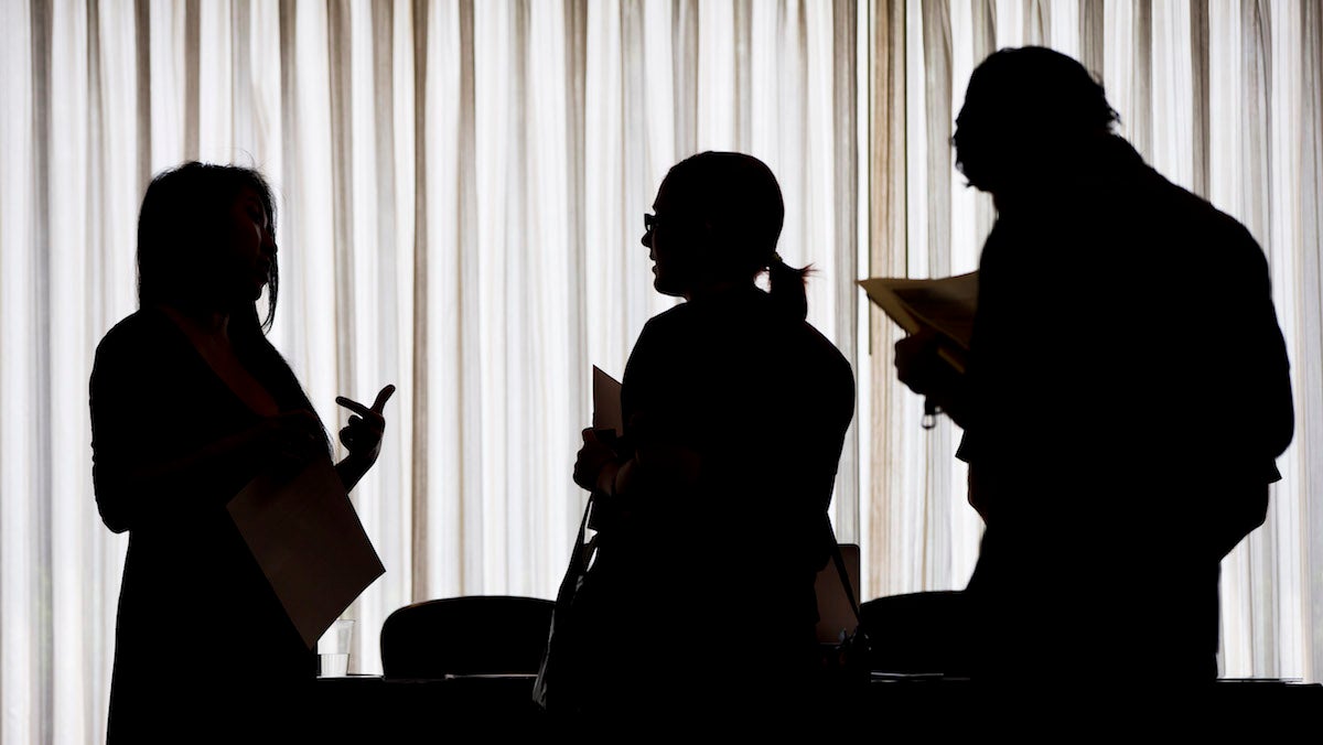  Applicants complete forms at a job fair in Newark N.J. in February 2013. (AP Photo/Mark Lennihan) 