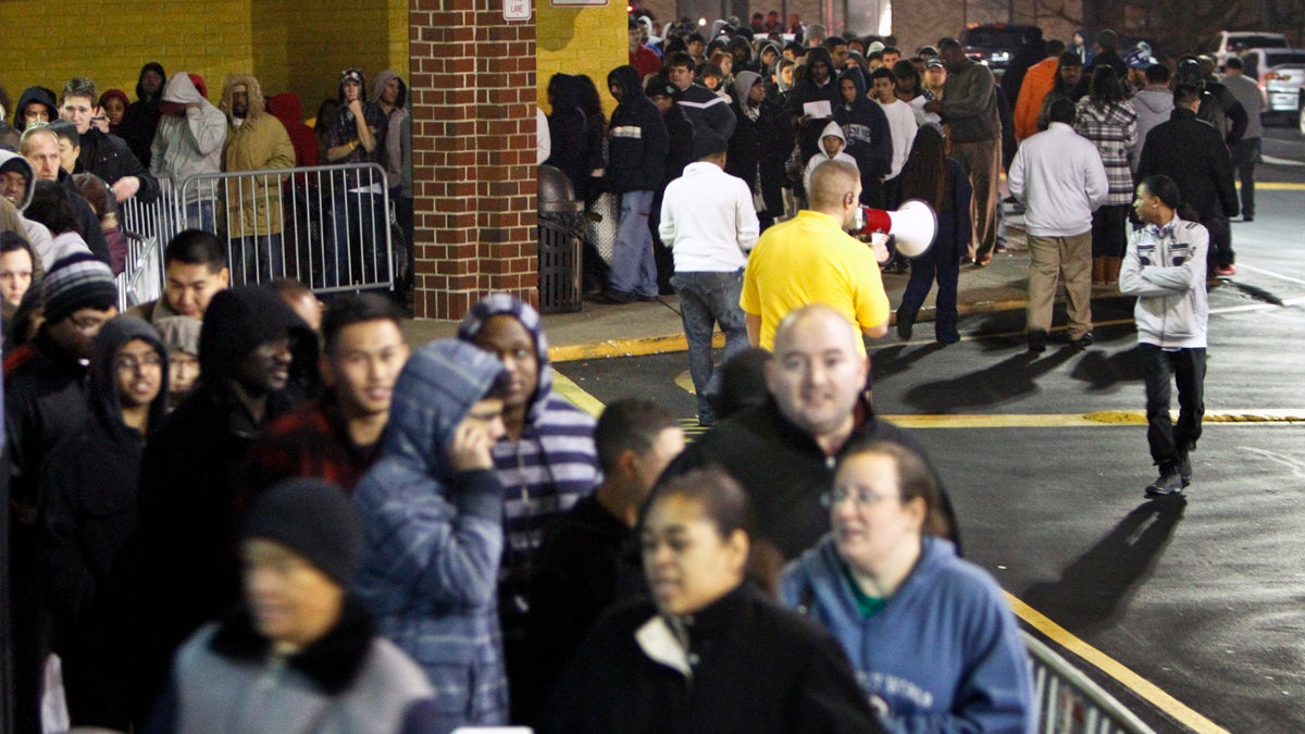  People wait in line late Thanksgiving night in 2012 for a Best Buy store in Northeast Philadelphia to open its doors at midnight. (AP file photo) 