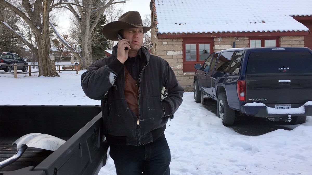  Ryan Bundy talks on the phone at the Malheur National Wildlife Refuge near Burns, Ore., Sunday, Jan. 3, 2016. Bundy is one of the protesters occupying the refuge to object to a prison sentence for local ranchers for burning federal land. (AP Photo/Rebecca Boone) 