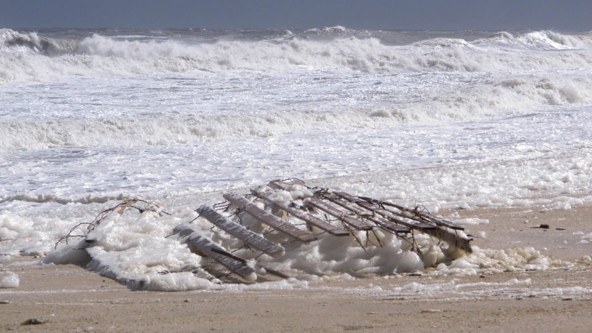  Last month. a section of dune fencing was knocked down by pounding surf in Point Pleasant Beach, New Jersey. Efforts to settle a lawsuit brought by the beach owner of against the state plan to build protective sand dunes are making progress. (AP Photo/Wayne Parry) 