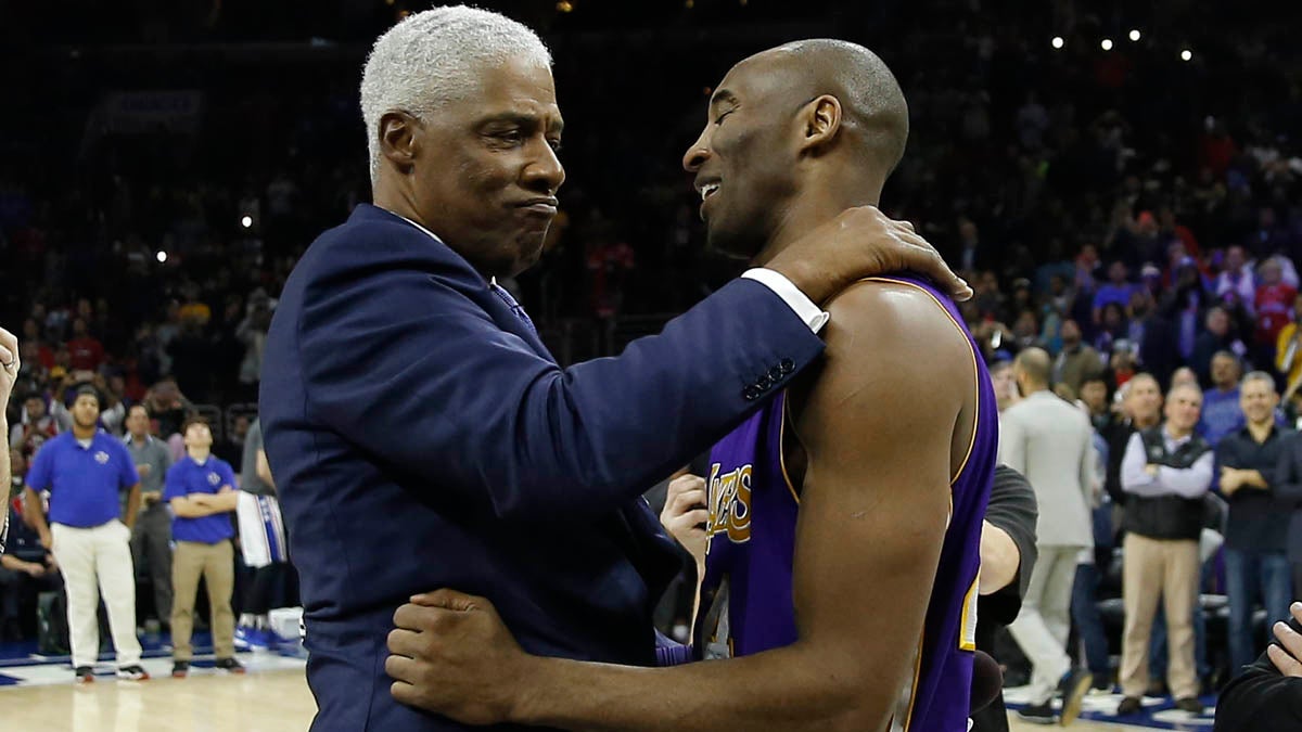  Los Angeles Lakers' Kobe Bryant, right, embraces former  76er Julius Erving ahead of a basketball game against the Philadelphia Sixers Tuesday in Philadelphia. Bryant announced his retirement Sunday. (AP Photo/Matt Slocum) 