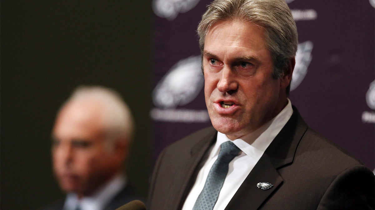  Philadelphia Eagles owner Jeffrey Lurie, left, listens as Doug Pederson, right, answers a question after he was introduced as the NFL football team's new head coach Tuesday in Philadelphia. (AP Photo/Mel Evans) 