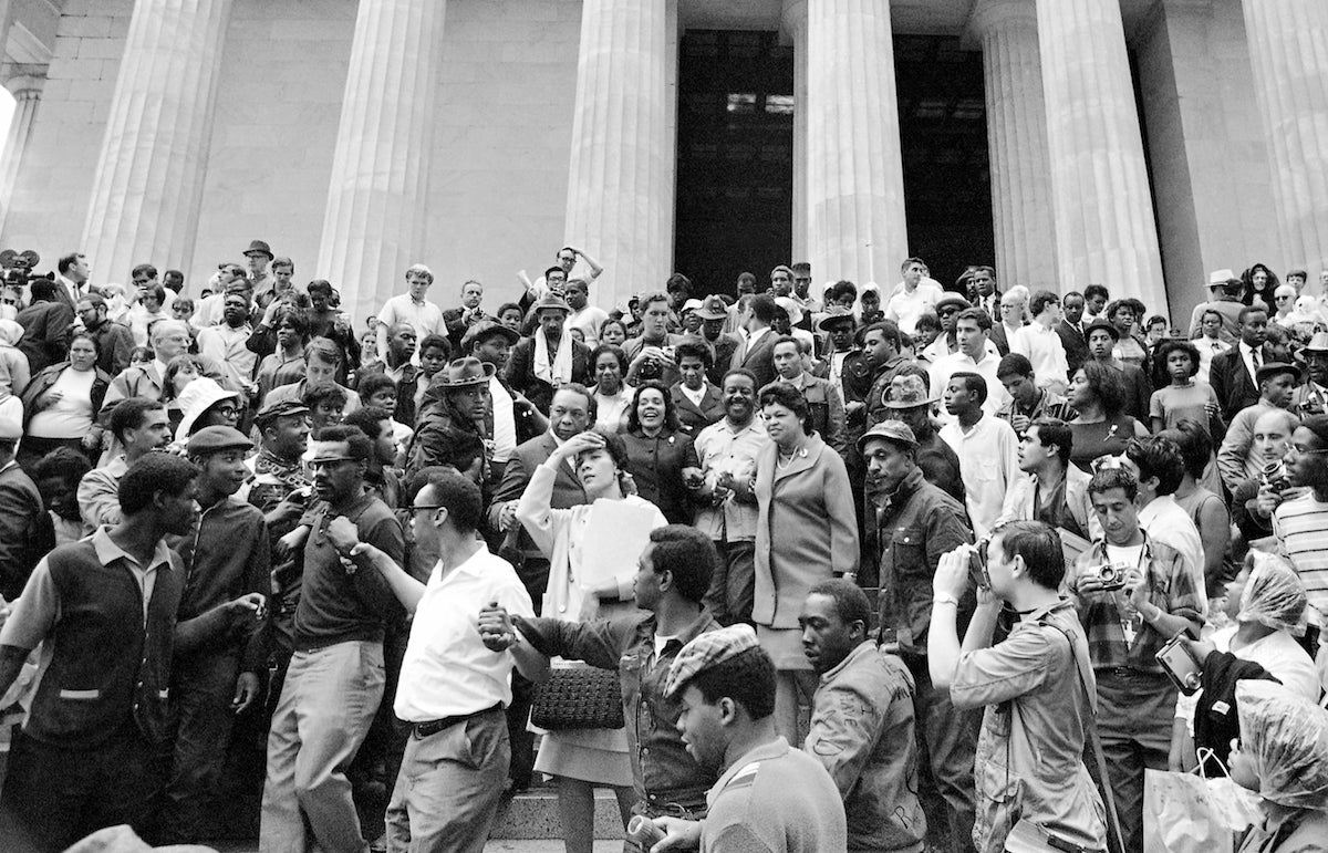  Coretta Scott King, center, is surrounded by members of the Poor People's Campaign, on the steps of the Lincoln Memorial in Washington, May 30, 1968. (AP Photo/Bob Schutz) 