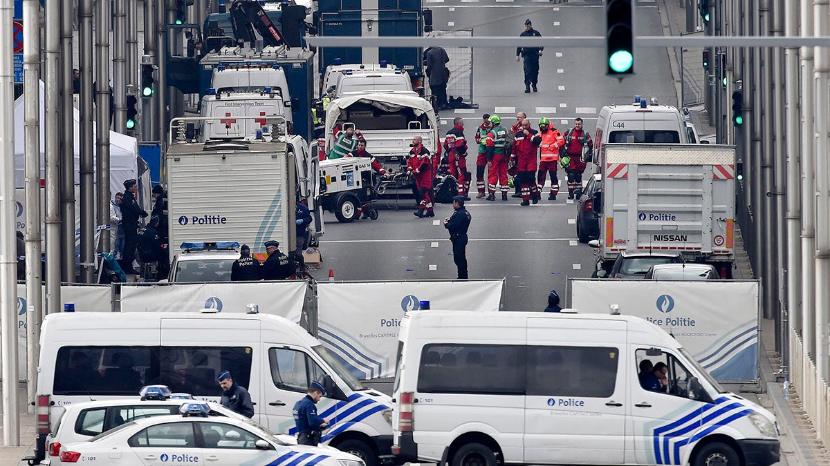 Police and rescue teams are pictured outside the metro station Maelbeek in Brussels