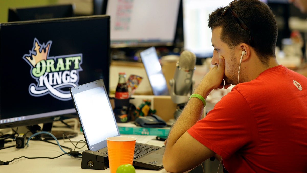 Devlin D'Zmura, a tending news manager at DraftKings, a daily fantasy sports company, works on his laptop at the company's offices in Boston. New Jersey lawmakers are trying to determine if DraftKings and other fantasy sports operations are games of skill or chance -- and whether they should be regulated. (AP photo/Stephan Savoia) 