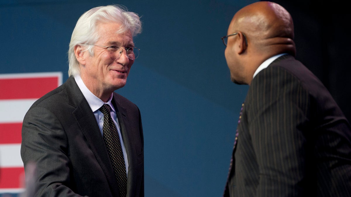  Actor, activist and philanthropist Richard Gere, left, greets Philadelphia Mayor Michael Nutter during the Liberty Medal ceremony at the National Constitution Center Monday evening in Philadelphia. The Dalai Lama, who canceled his public appearances this month because of health reasons, is this year's recipient. The honor is given annually to an individual who displays courage and conviction while striving to secure liberty for people worldwide. (AP Photo/Matt Rourke 