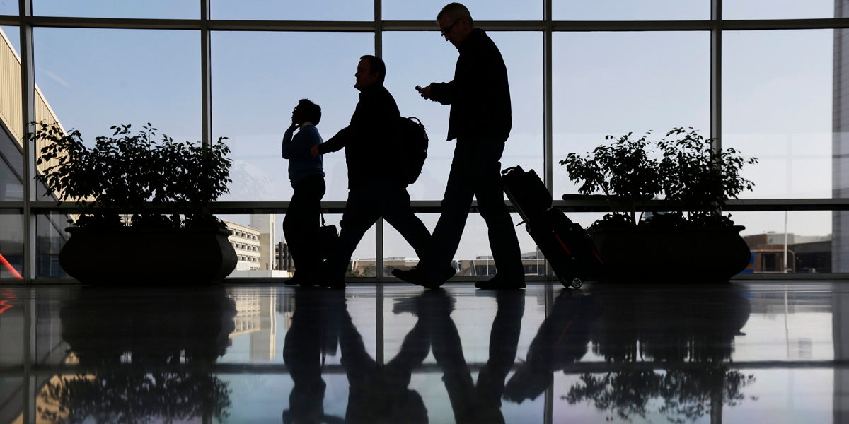 Travelers pass through a corridor at Philadelphia International Airport. (AP file photo) 