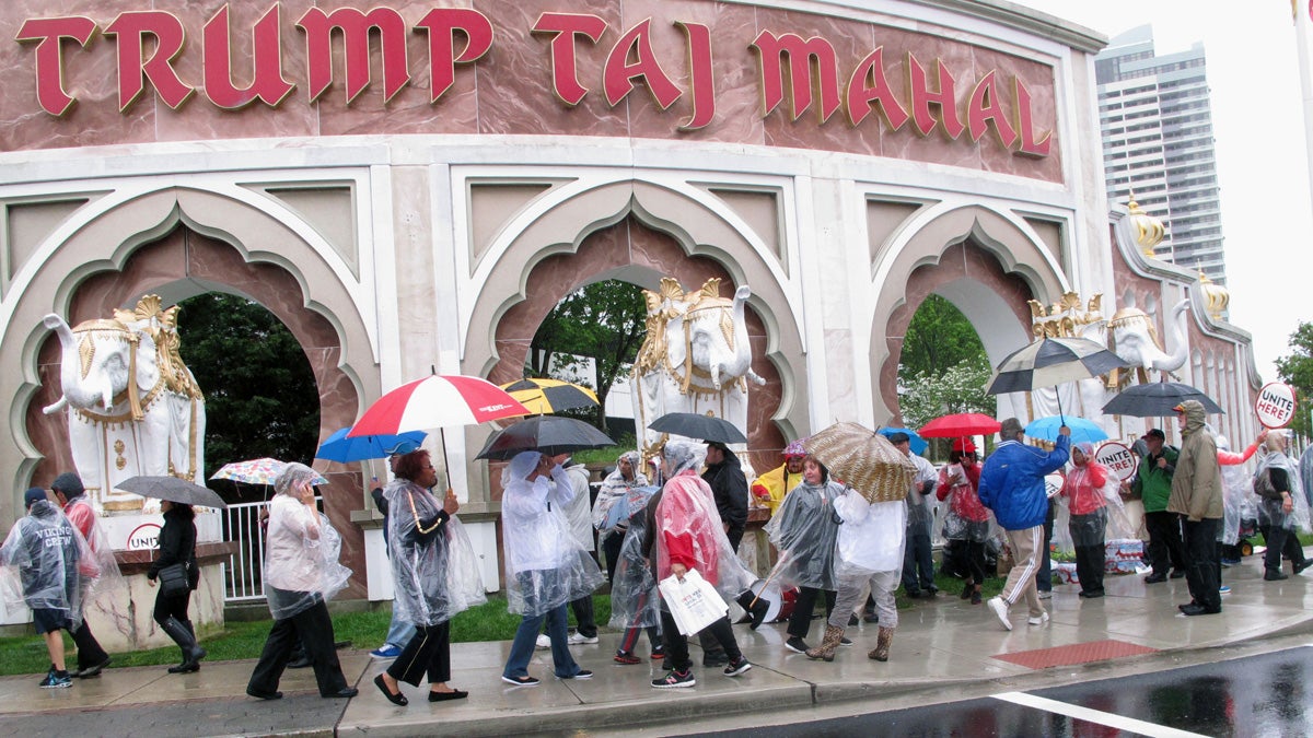  Local 54 union members picket outside the Trump Taj Mahal Casino Resort in Atlantic City in May to protest  elimination of their health insurance and pension benefits by a bankruptcy court judge. Union leaders are preparing for a possible strike.  (AP file photo) 