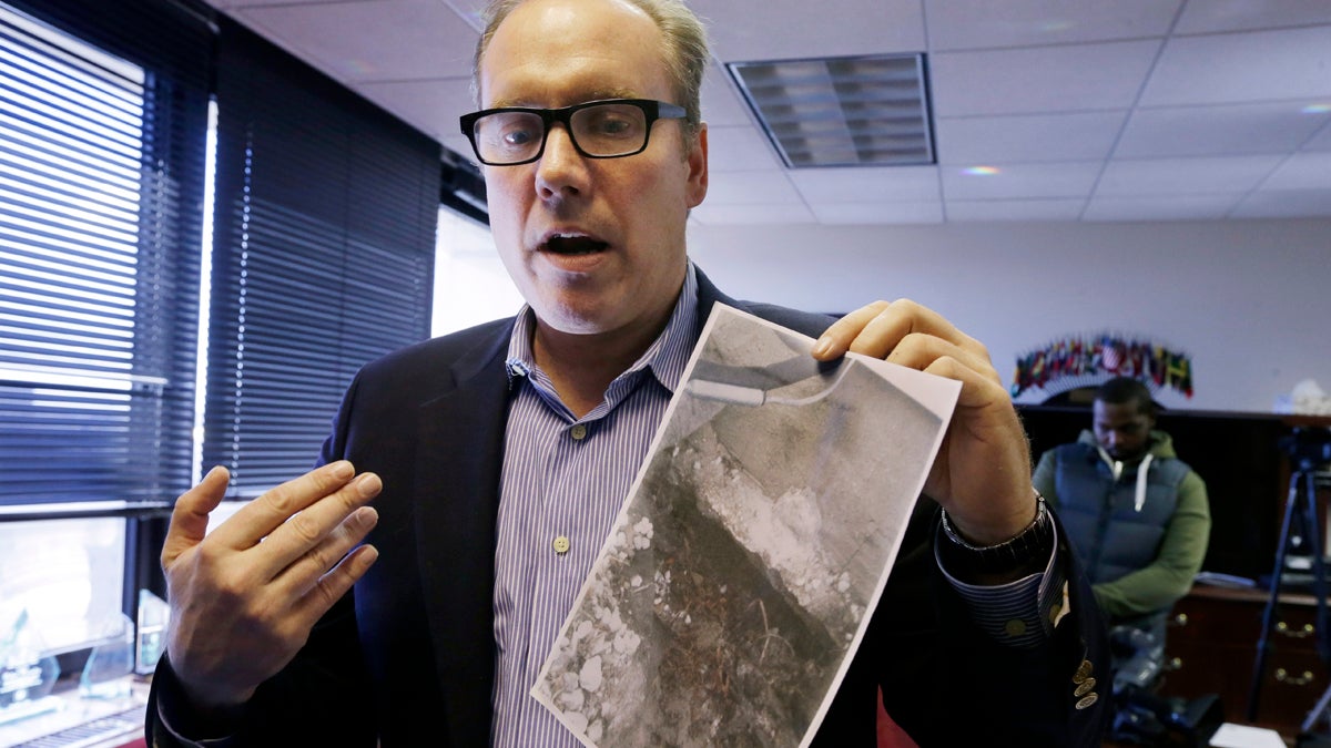 Douglas Quinn Last year, Douglas Quinn of Toms River, New Jersey, holds a photograph showing damage to his home after Superstorm Sandy. He said his insurance company contended that the damage was pre-existing and refused his claim. Homeowners in a similar situation have until Thursday to request a FEMA review of claims that have been turned down. (AP file photo)
